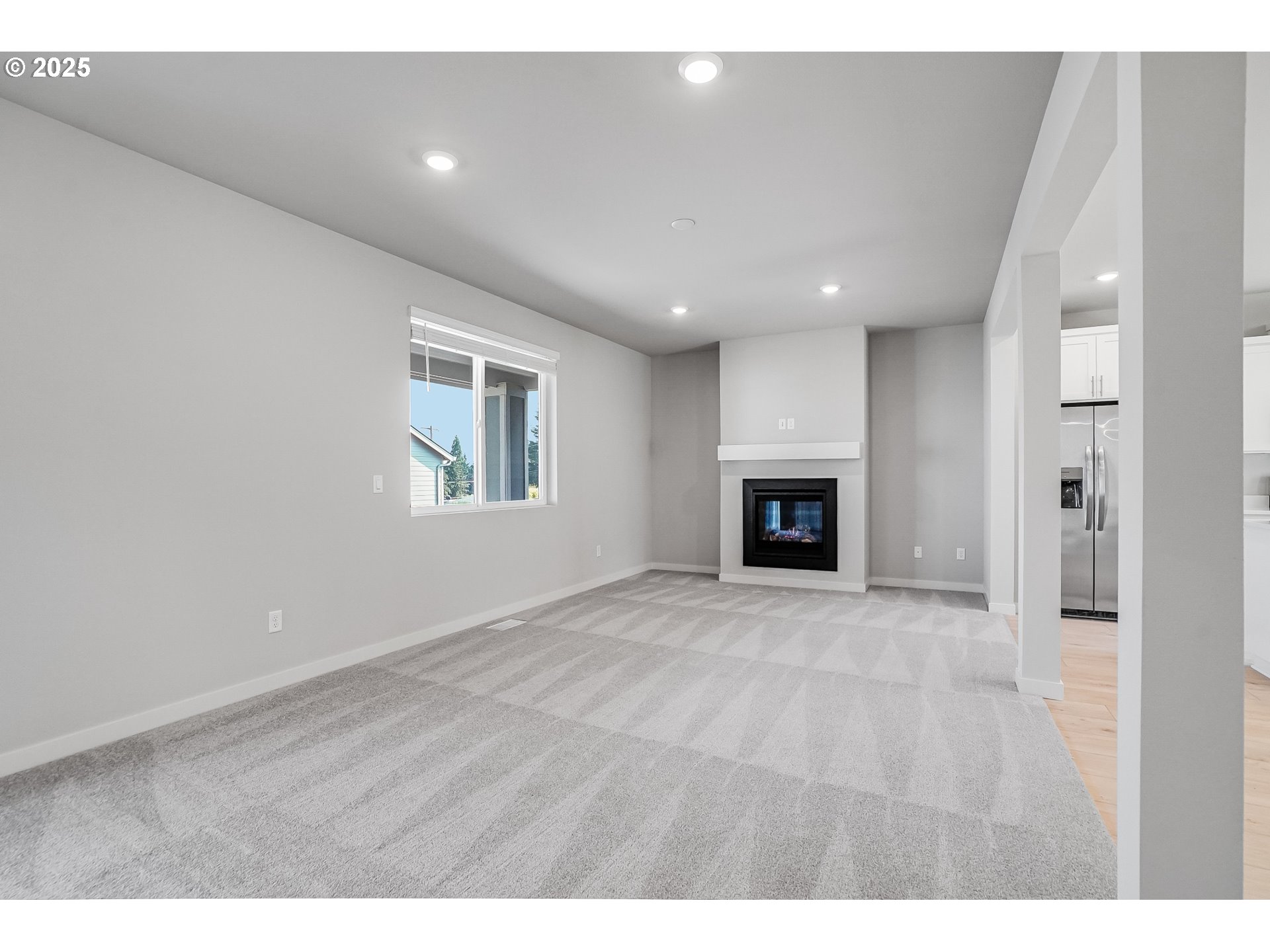 3230 Misty Lane Forest Grove, OR 97116 - Photo 12 of 33 a view of an empty room with a fireplace and a window
