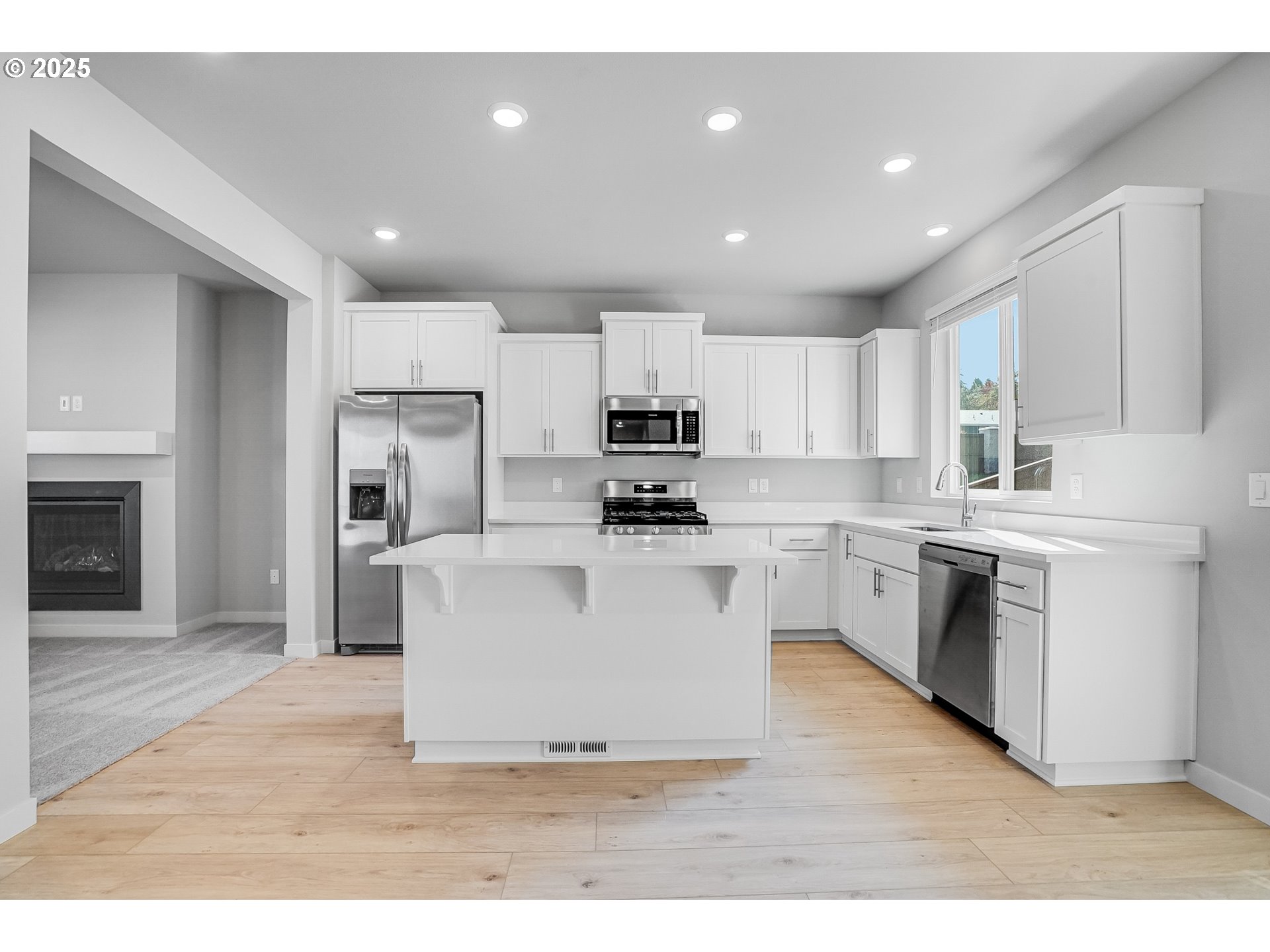3230 Misty Lane Forest Grove, OR 97116 - Photo 6 of 33 a kitchen with cabinets and stainless steel appliances