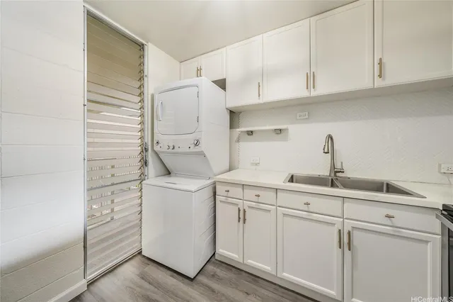 a kitchen with stainless steel appliances a refrigerator sink and microwave