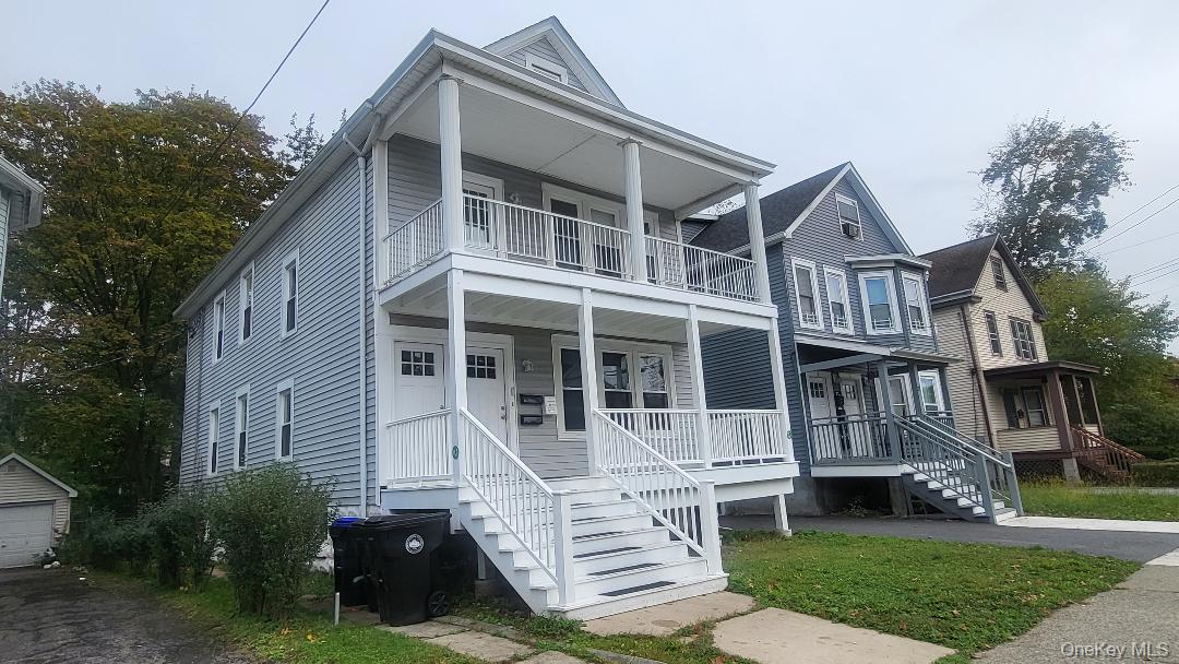 19 Hoffman Avenue, Unit 2 Poughkeepsie, NY 12603 - Photo 20 of 21 a front view of a house with a yard