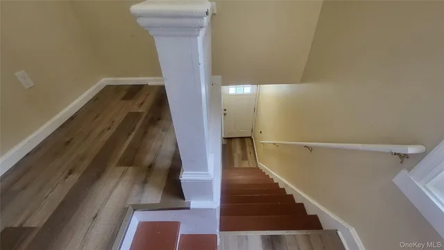a view of entryway with wooden floor