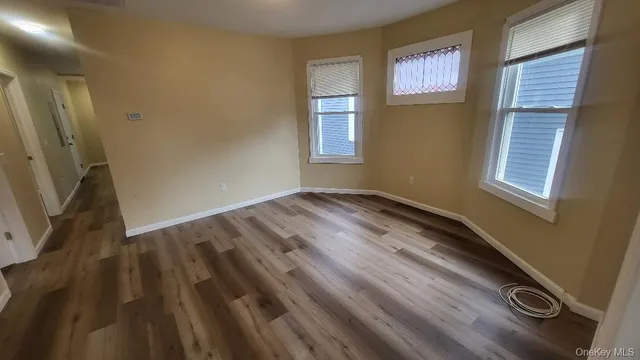a view of empty room with windows