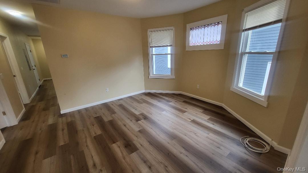 19 Hoffman Avenue, Unit 2 Poughkeepsie, NY 12603 - Photo 7 of 21 a view of empty room with windows