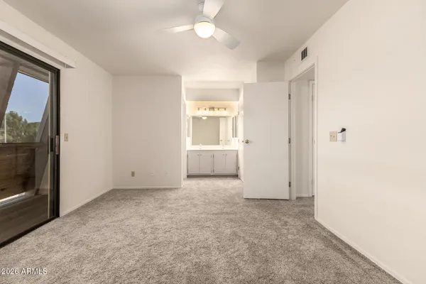 a view of an empty room with a window