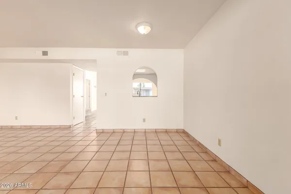 a view of an empty room and window