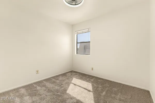 a view of a storage & utility room with a window