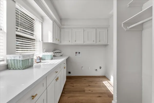 a spacious bathroom with a granite countertop sink a large mirror and a shower