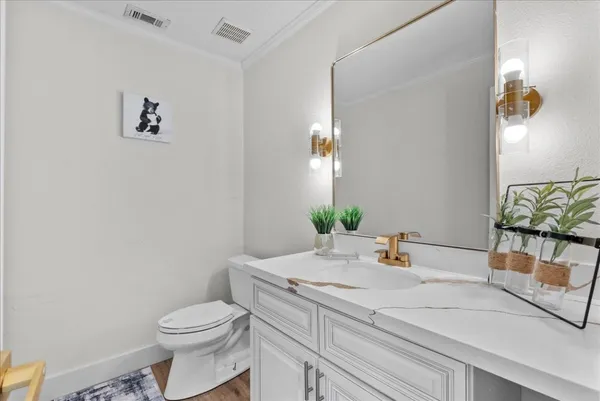 a bathroom with a granite countertop sink mirror and a bathtub