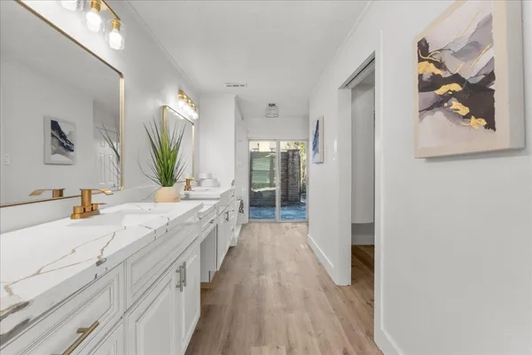 a bathroom with bathtub and window