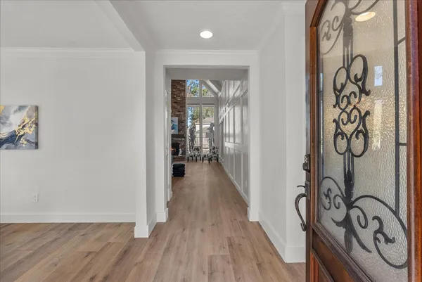 a living room with furniture wooden floor and a fireplace