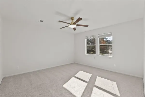 a view of a house with garden and sitting area