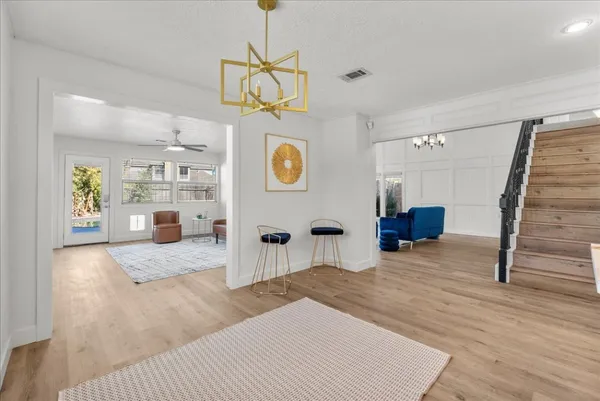 a kitchen with a sink a stove and cabinets
