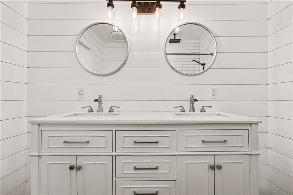 4139 Rebecca Street Southwest Covington, GA 30014 - Photo 15 of 33 a bathroom with a sink and a mirror