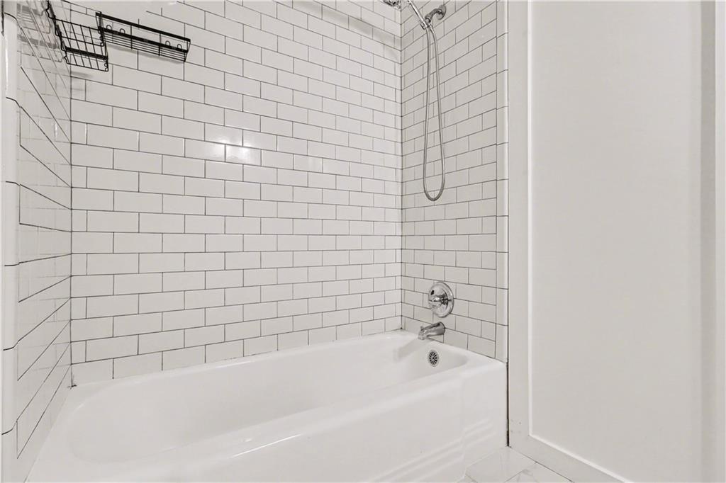 4139 Rebecca Street Southwest Covington, GA 30014 - Photo 16 of 33 a bathroom with a bathtub