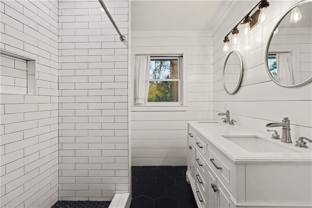 4139 Rebecca Street Southwest Covington, GA 30014 - Photo 17 of 33 a bathroom with a sink and a mirror