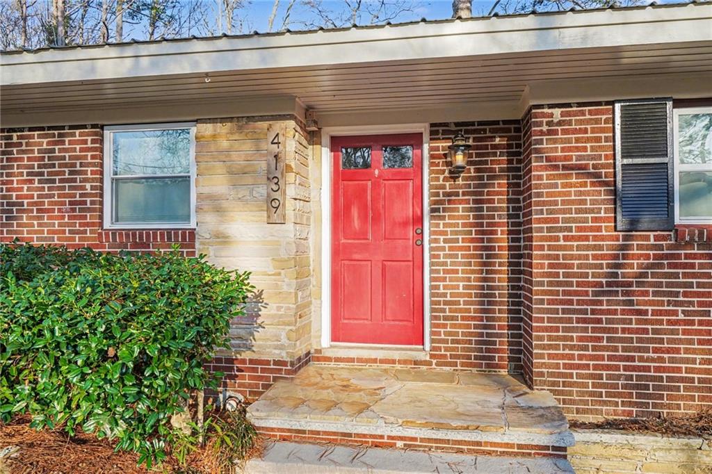 4139 Rebecca Street Southwest Covington, GA 30014 - Photo 2 of 33 a front view of a house with a yard