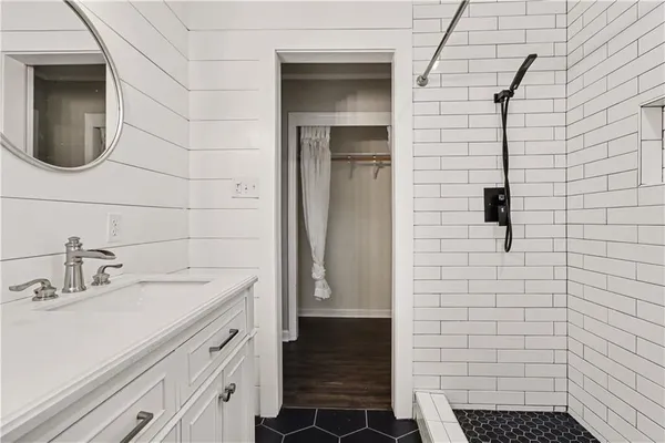 a bathroom with a sink and a shower