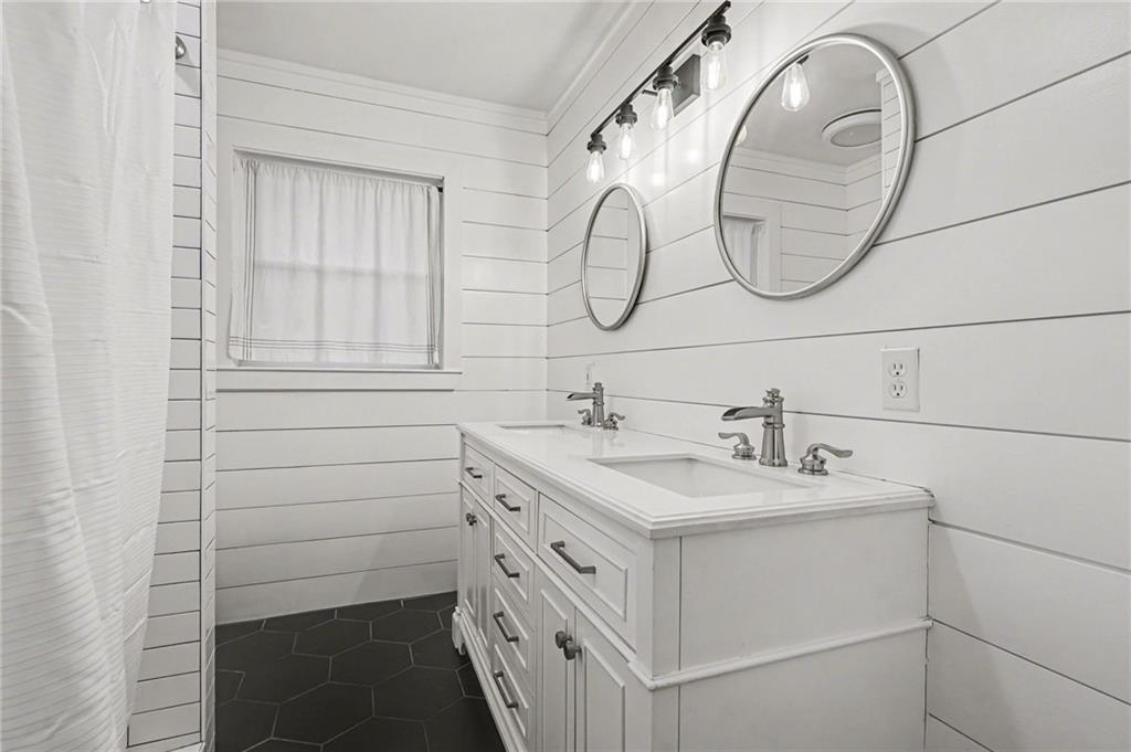 4139 Rebecca Street Southwest Covington, GA 30014 - Photo 22 of 33 a bathroom with a sink and a mirror