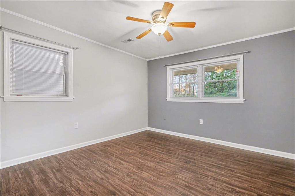 4139 Rebecca Street Southwest Covington, GA 30014 - Photo 24 of 33 a view of an empty room with window and wooden floor