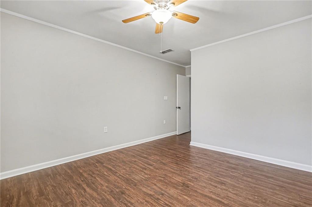 4139 Rebecca Street Southwest Covington, GA 30014 - Photo 28 of 33 a view of an empty room with wooden floor