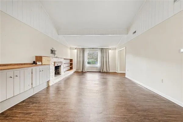 a view of a kitchen with wooden floor