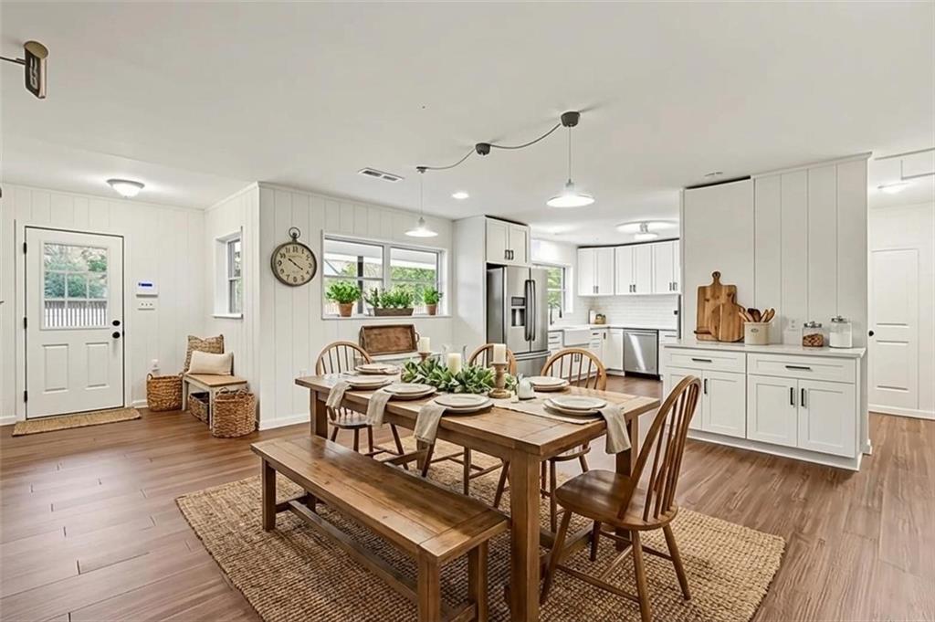 4139 Rebecca Street Southwest Covington, GA 30014 - Photo 7 of 33 a view of a dining room with furniture window and wooden floor