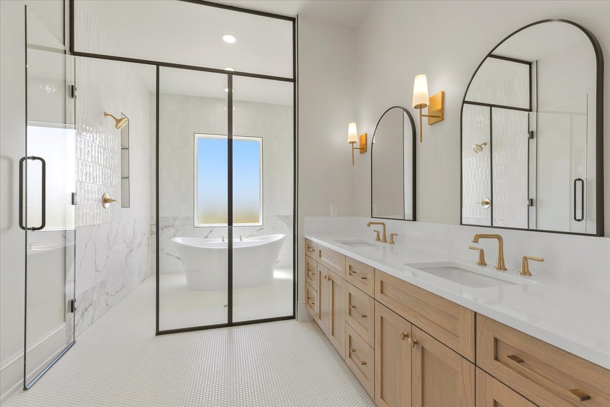 224 Sandia Loop Kingsland, TX 78639 - Photo 17 of 32 a bathroom with a double vanity sink mirror and shower