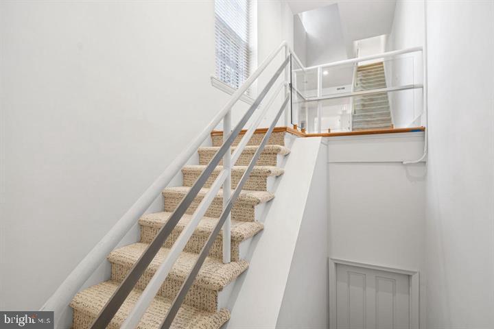 306 South 10th Street, Unit D Philadelphia, PA 19107 - Photo 14 of 35 a view of staircase with white walls and white door