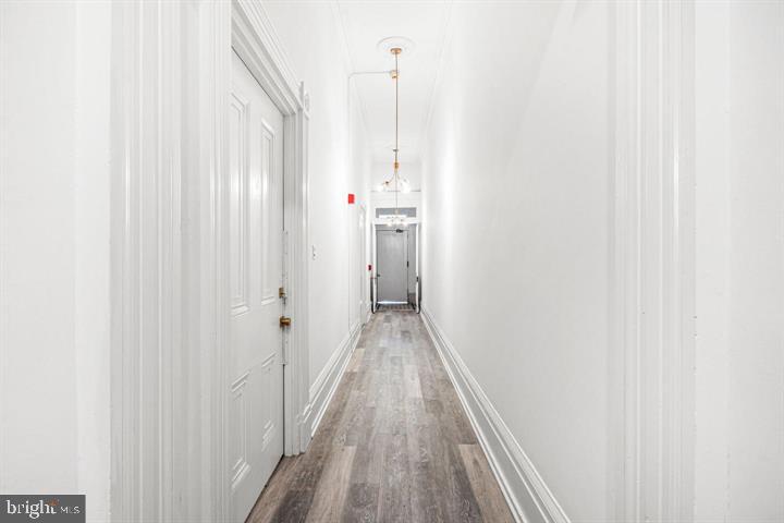 306 South 10th Street, Unit D Philadelphia, PA 19107 - Photo 28 of 35 a view of a hallway with wooden floor and staircase