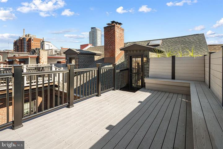 306 South 10th Street, Unit D Philadelphia, PA 19107 - Photo 3 of 35 a view of a balcony with wooden floor and outdoor space