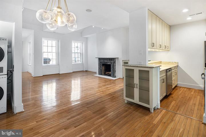 306 South 10th Street, Unit D Philadelphia, PA 19107 - Photo 8 of 35 a view of a kitchen with furniture a fireplace and wooden floor
