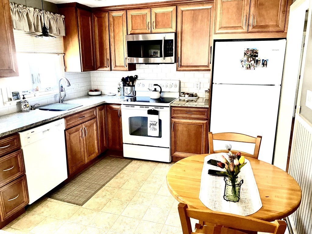 110 Carolyn Road Weymouth, MA 02190 - Photo 14 of 18 a kitchen with stainless steel appliances a stove a sink and a refrigerator