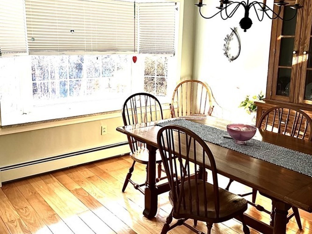 110 Carolyn Road Weymouth, MA 02190 - Photo 4 of 18 a view of a dining room with furniture window and wooden floor