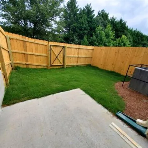 a backyard of a house with lots of green space