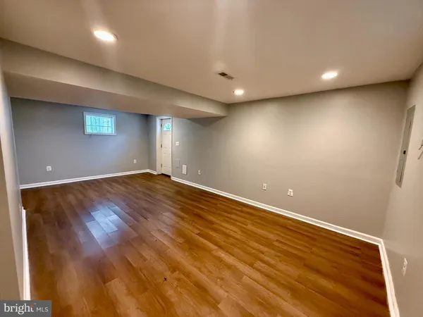 a view of room and wooden floor