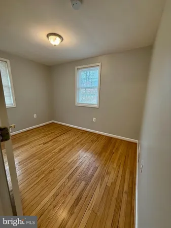 a view of room with wooden floor