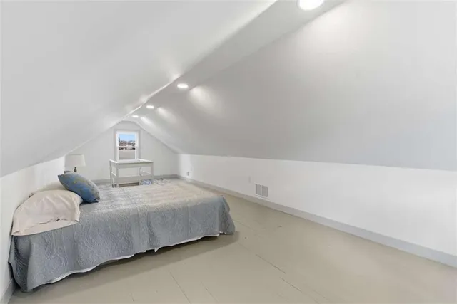 a view of empty room with wooden ceiling