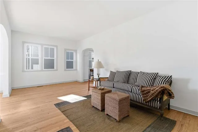 a bedroom with furniture and wooden floor