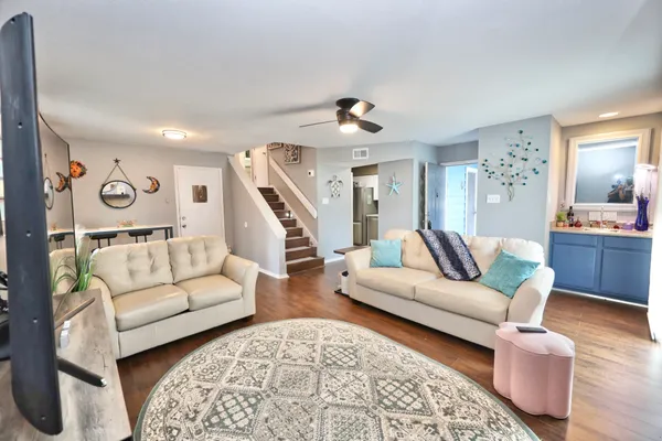 a living room with furniture and a flat screen tv