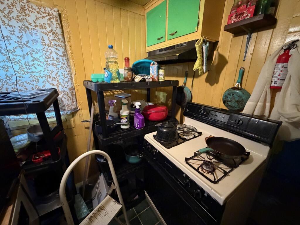 259 South Ivanhoe Road Kingsford Heights, IN 46346 - Photo 13 of 22 a room with storage and utility