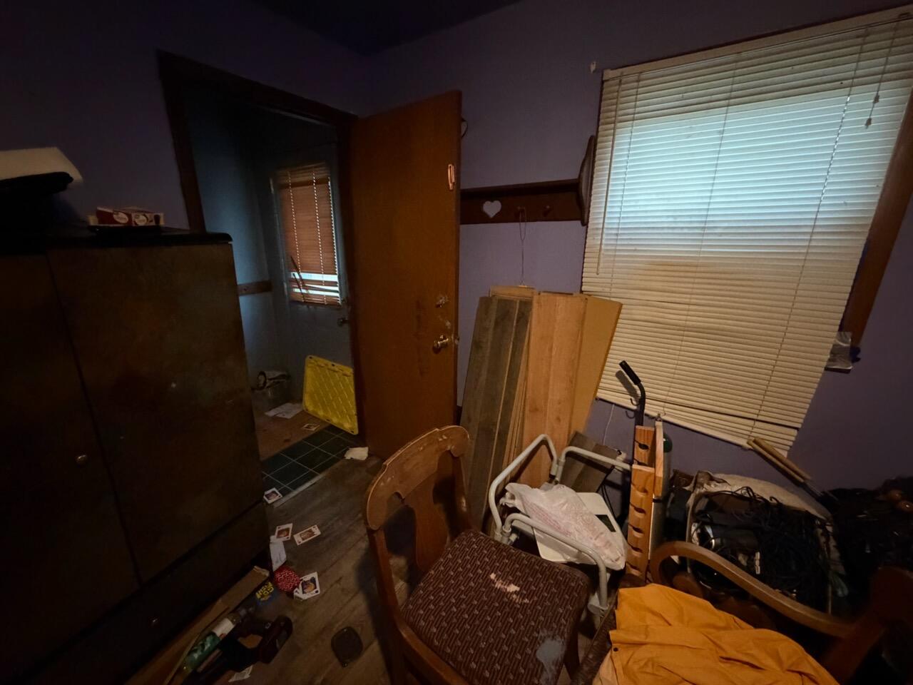 259 South Ivanhoe Road Kingsford Heights, IN 46346 - Photo 18 of 22 a bathroom with a sink and mirror