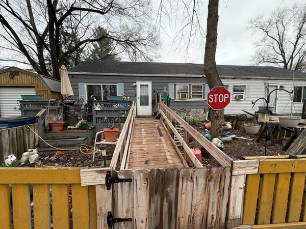 a front view of house yard and patio
