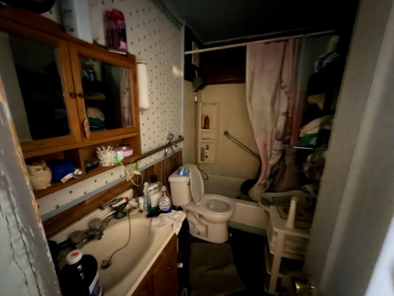 259 South Ivanhoe Road Kingsford Heights, IN 46346 - Photo 22 of 22 a bathroom with a sink toilet and shower