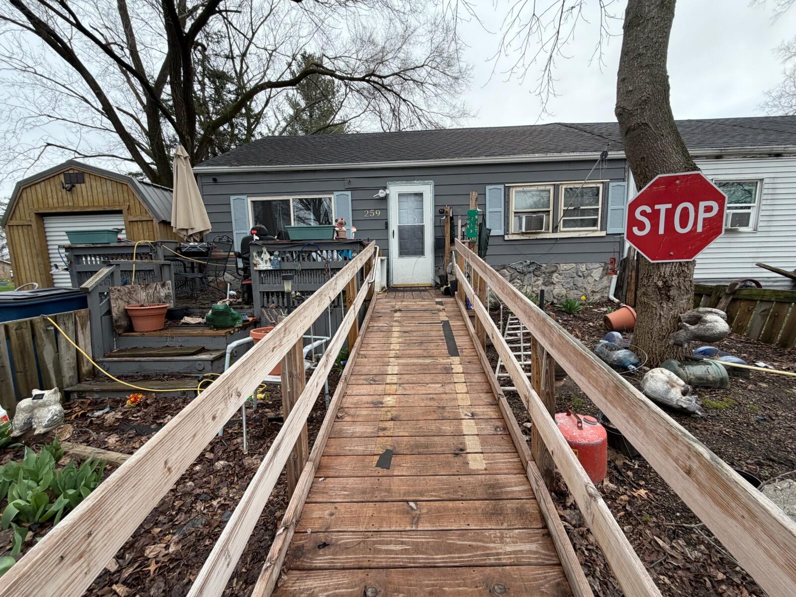 259 South Ivanhoe Road Kingsford Heights, IN 46346 - Photo 3 of 22 a front view of a house with a park