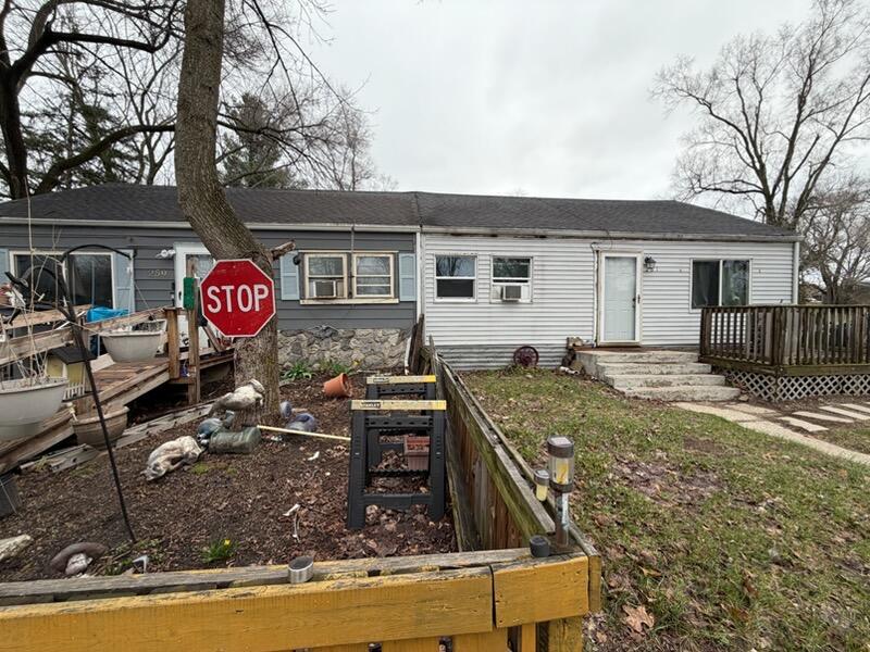 259 South Ivanhoe Road Kingsford Heights, IN 46346 - Photo 5 of 22 a view of a house with backyard