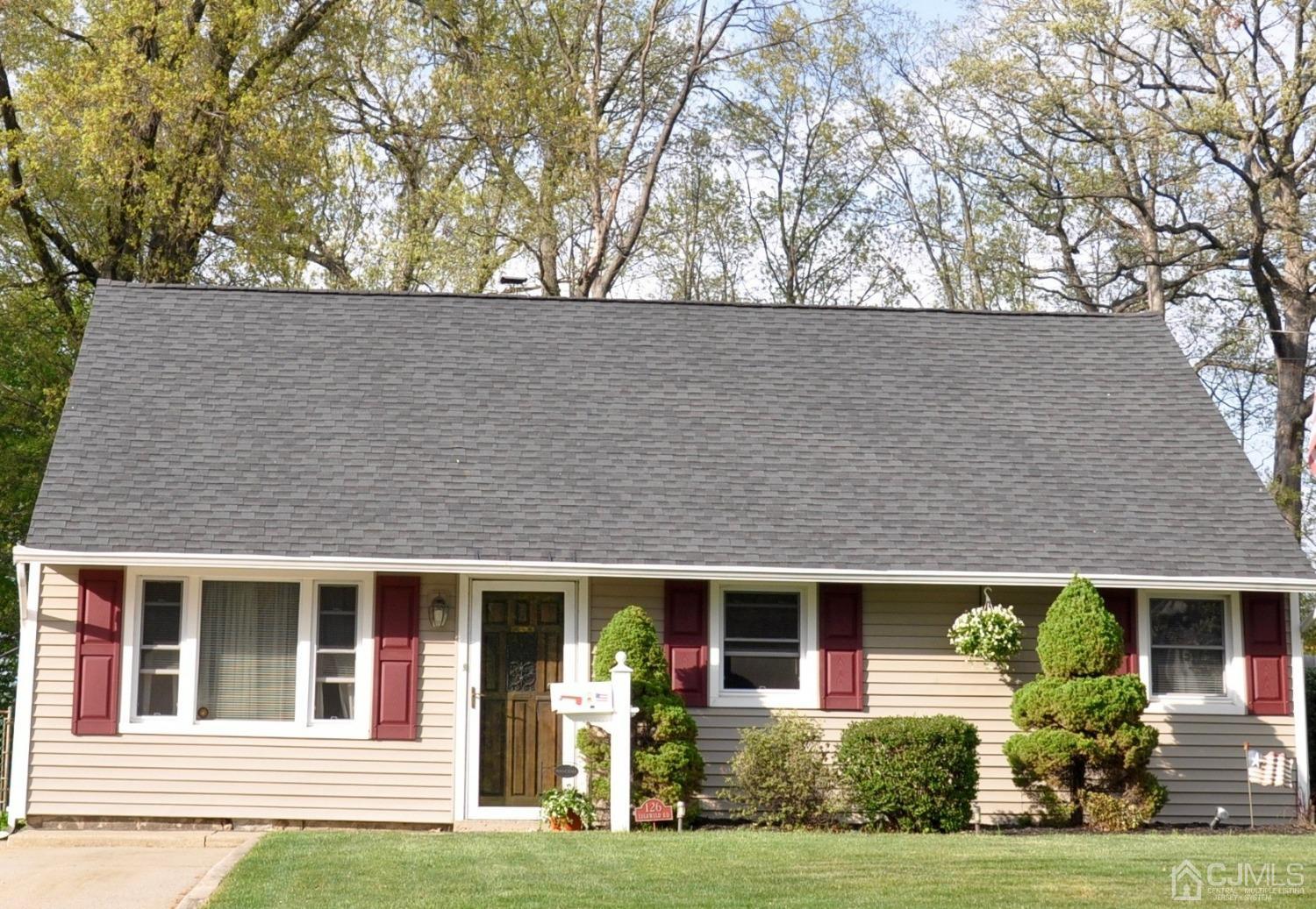 126 Idlewild Road Edison, NJ 08817 - Photo 1 of 12 front view of house with a garden