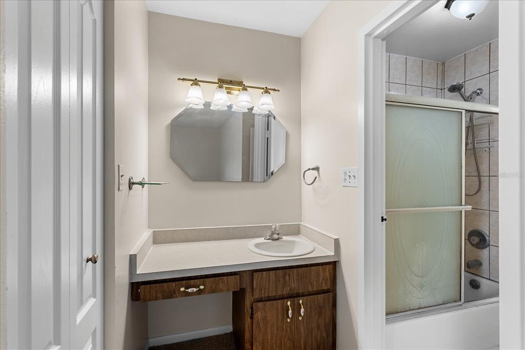 2786 Curry Ford Road, Unit 6B Orlando, FL 32806 - Photo 13 of 27 a bathroom with a sink and a mirror
