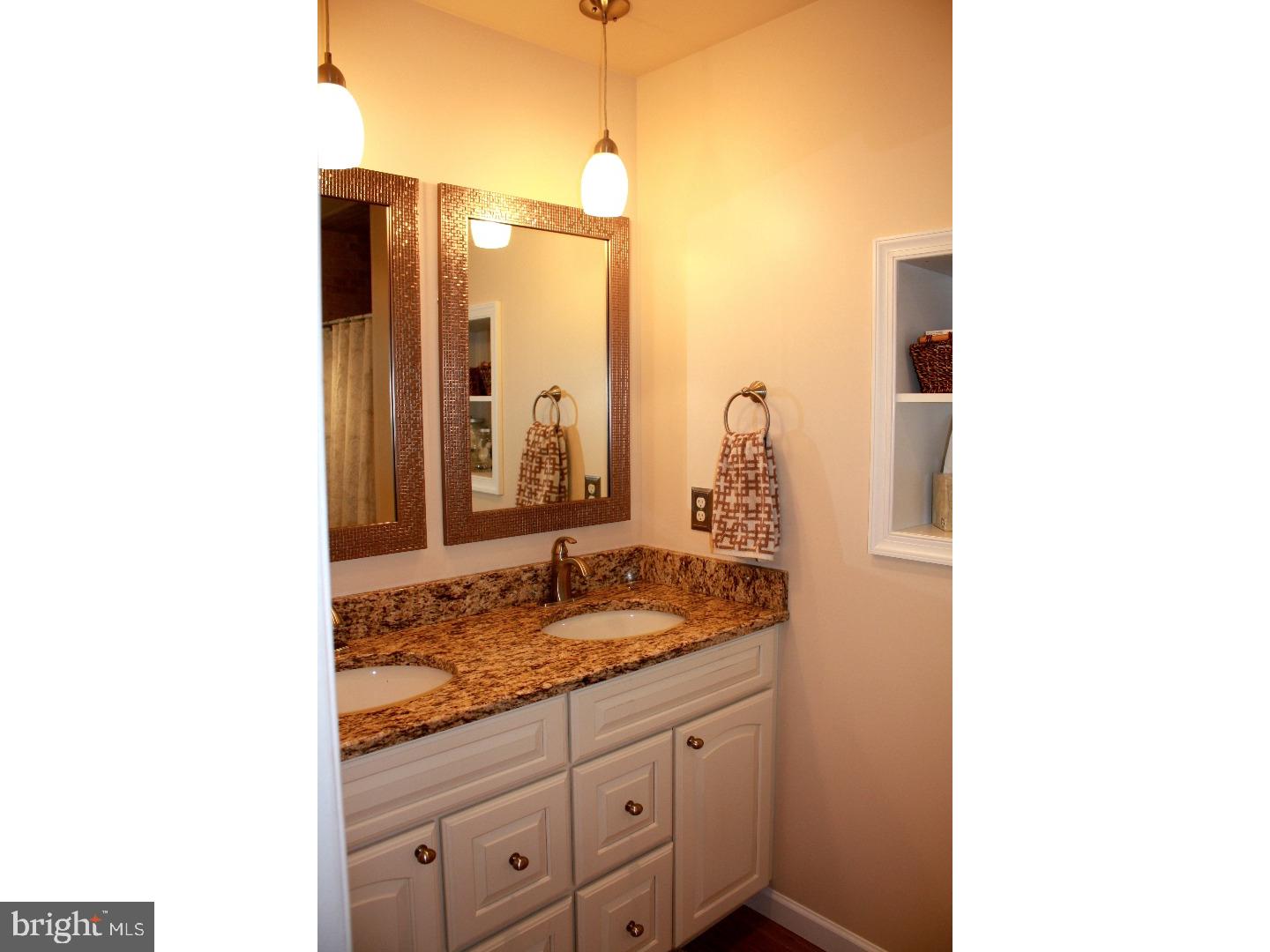 1017 North Ridge Road Chadds Ford, PA 19317 - Photo 14 of 20 a bathroom with a granite countertop sink and a mirror