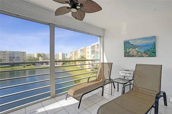 a room with furniture and a large window