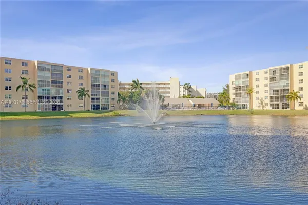 a view of water with a tall building